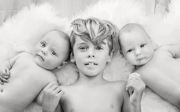 Gorgeous sibling photo of twin babies taken by our Auckland baby photographer at Milk Photography Studio